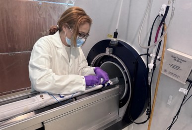 A researcher using the 7-Tesla Bruker Biospec 70/30 magnetic resonance imaging scanner.